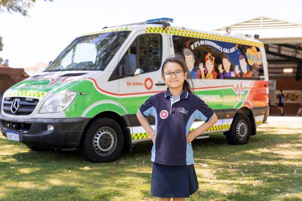 Kalamunda Youth First Aid Girl in front of Wiggles Ambulance